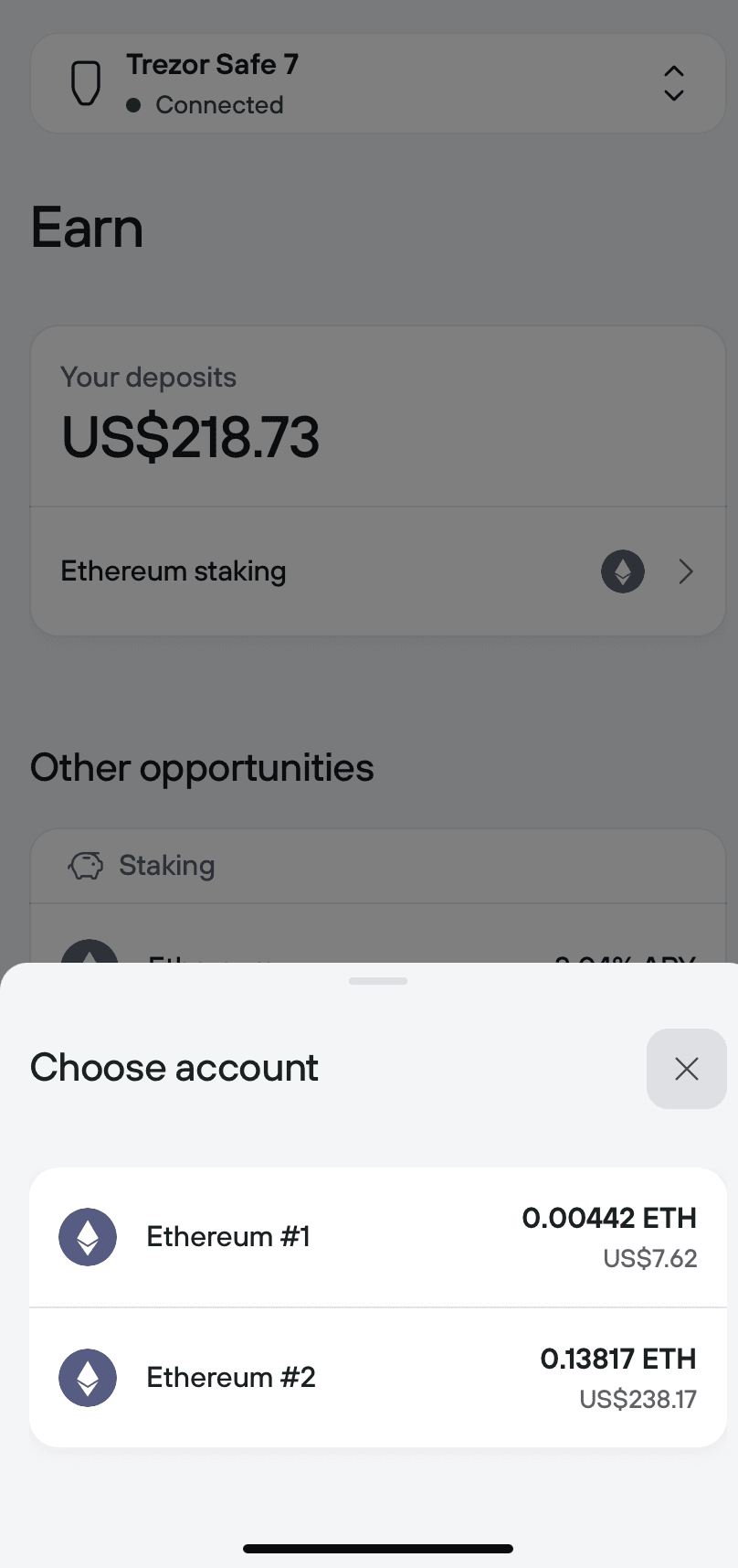 Choose account sheet lists two Ethereum accounts with balances before staking