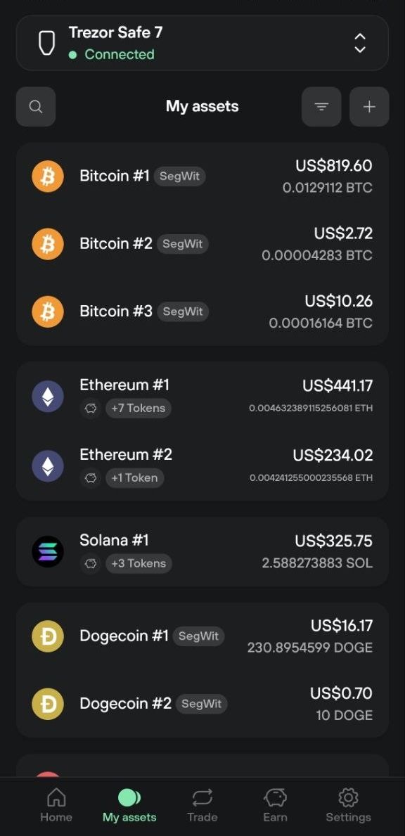 Trezor Suite My assets tab listing Bitcoin, Ethereum, Solana, and Dogecoin account balances