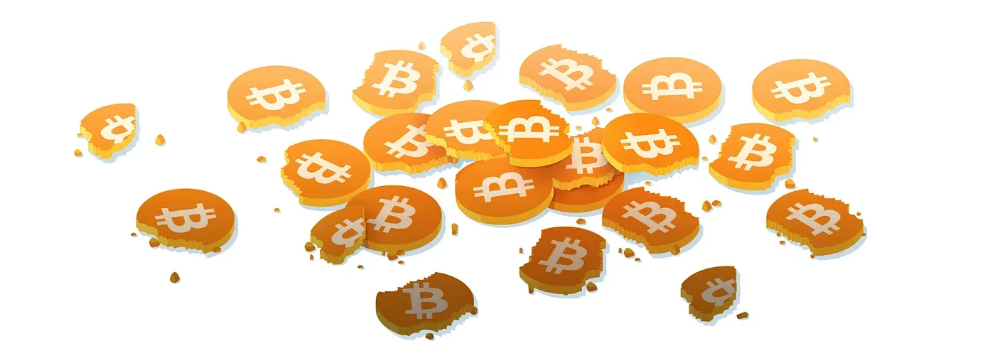 Scattered broken bitcoin coins and crumbs across a white background