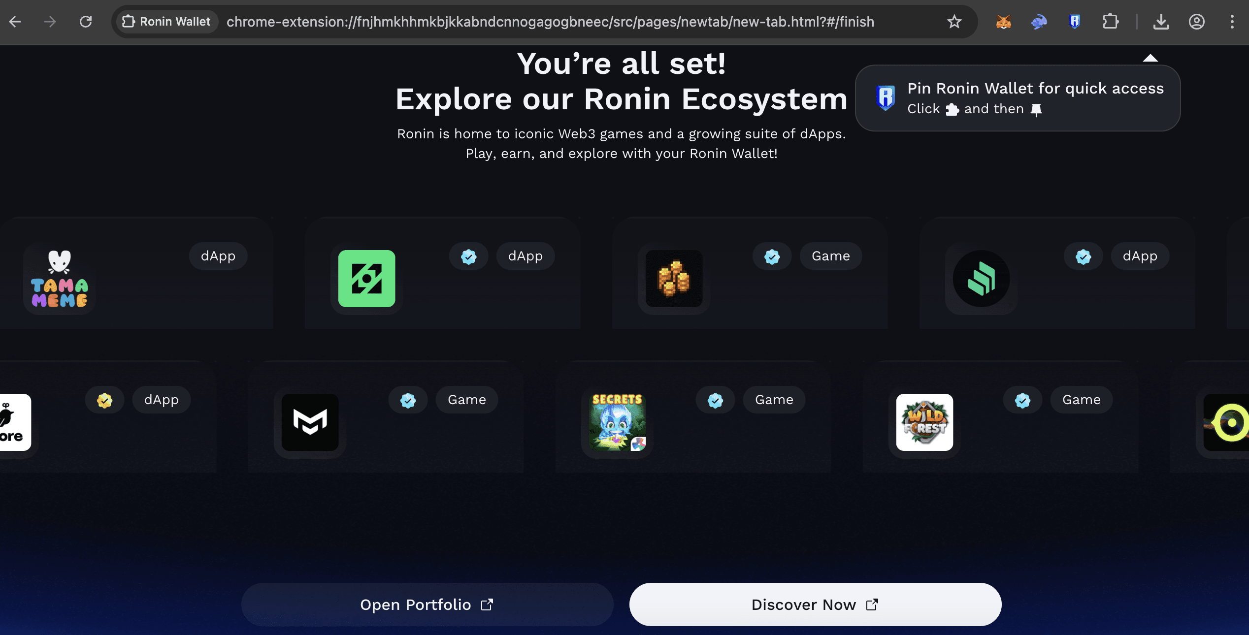 Ronin Wallet confirmation screen showing dApps and games in the ecosystem, with options to open portfolio or discover more.