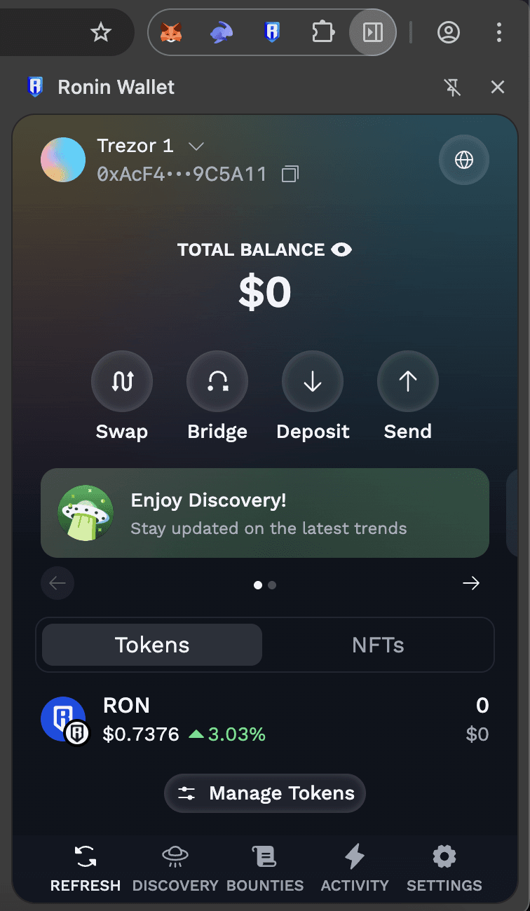 Ronin Wallet extension showing a connected Trezor account with $0 total balance, RON token details, and action buttons for Swap, Bridge, Deposit, and Send.