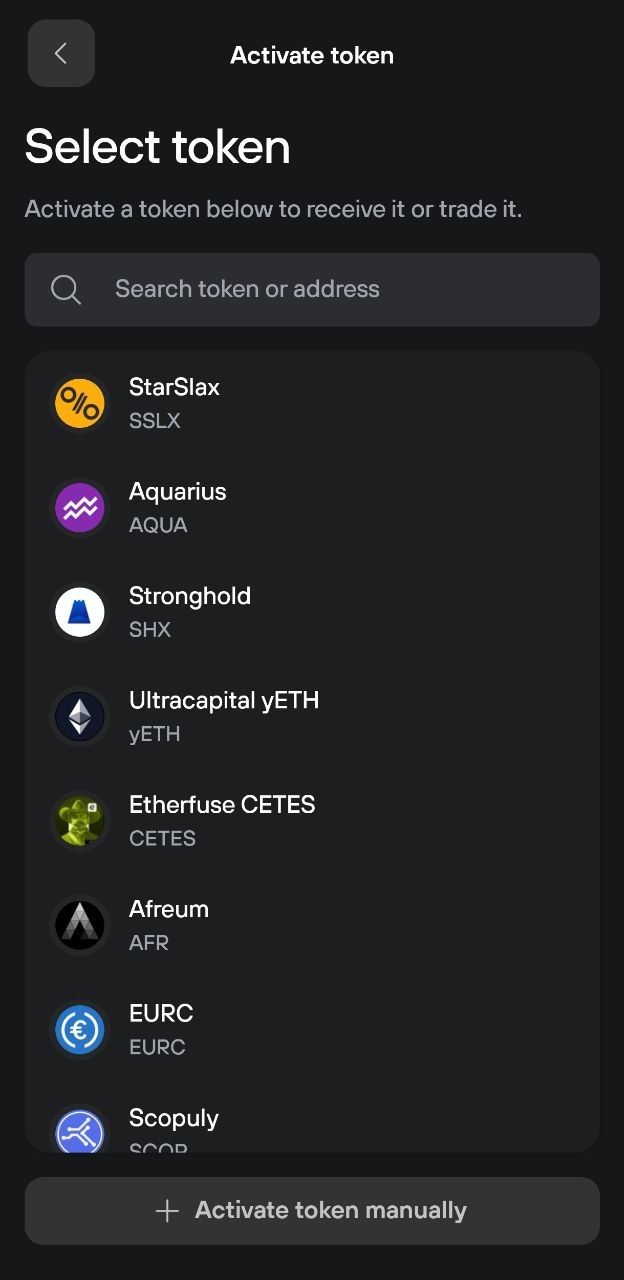 Trezor Suite Activate token screen showing searchable Stellar token list and manual activation option