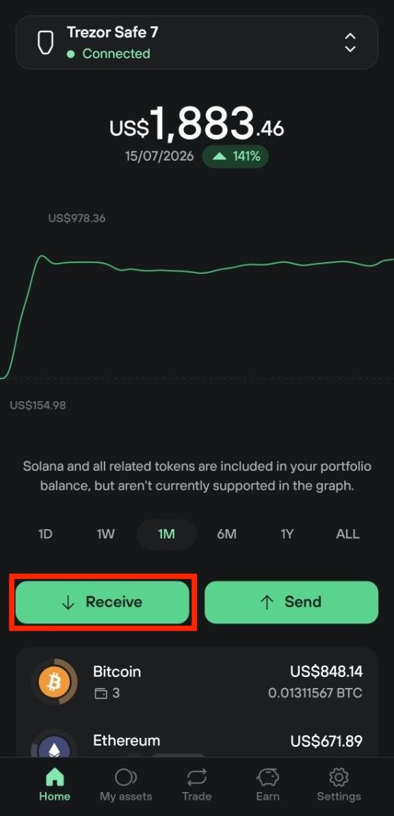 Trezor Suite mobile dashboard with the Receive button highlighted below the one-month portfolio chart