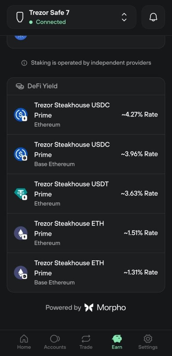 Trezor Suite Earn tab lists five DeFi Yield vaults for USDC, USDT, and ETH on Ethereum and Base.