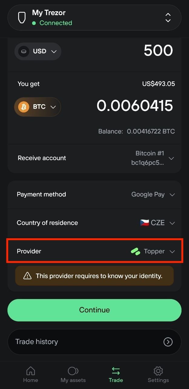 Mobile buy form showing BTC amount, Google Pay, country, and highlighted Topper provider with identity notice