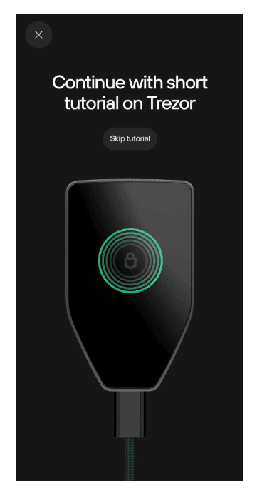 Prompt to continue a short tutorial on Trezor Safe 5, with Skip tutorial button and lock icon on device.